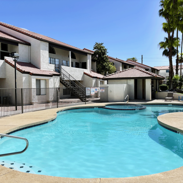 Pool beside apartment buildings.