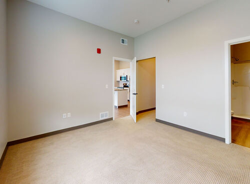 Main bedroom with en-suite full bathroom in 2 bedroom apartment at Lofts at 128 located in downtown Hastings, MI