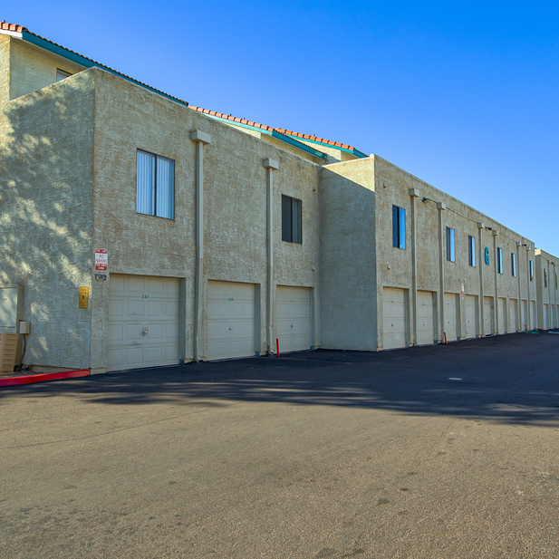 Apartment building exterior and parking area.