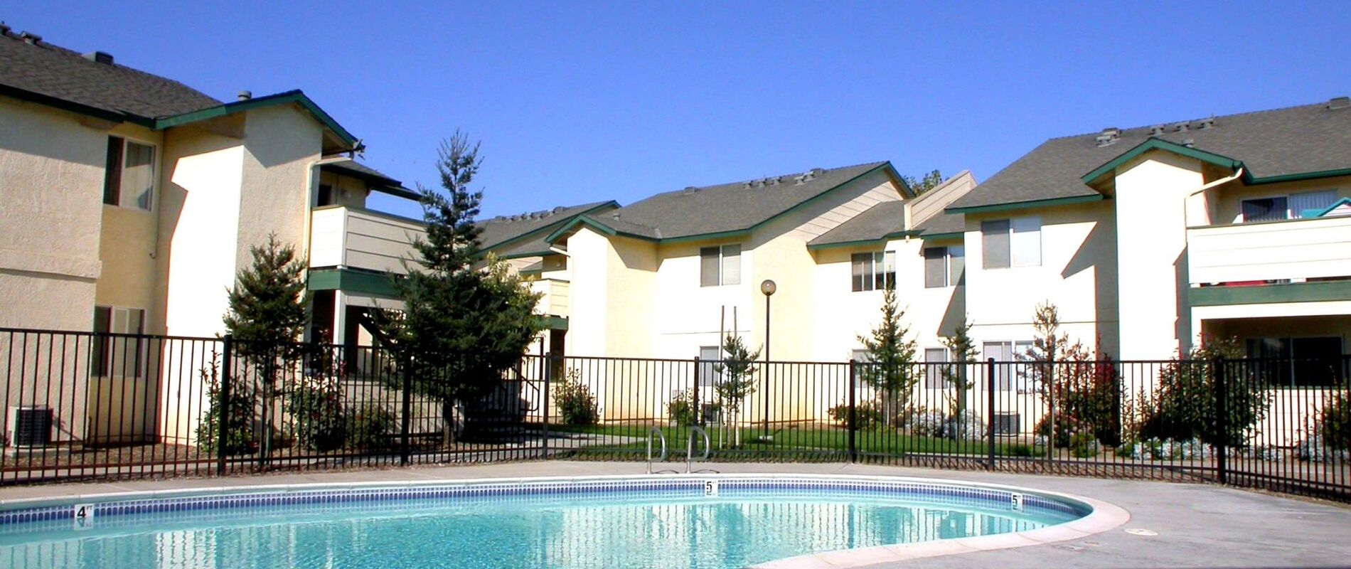 Pool With Apartments In Back