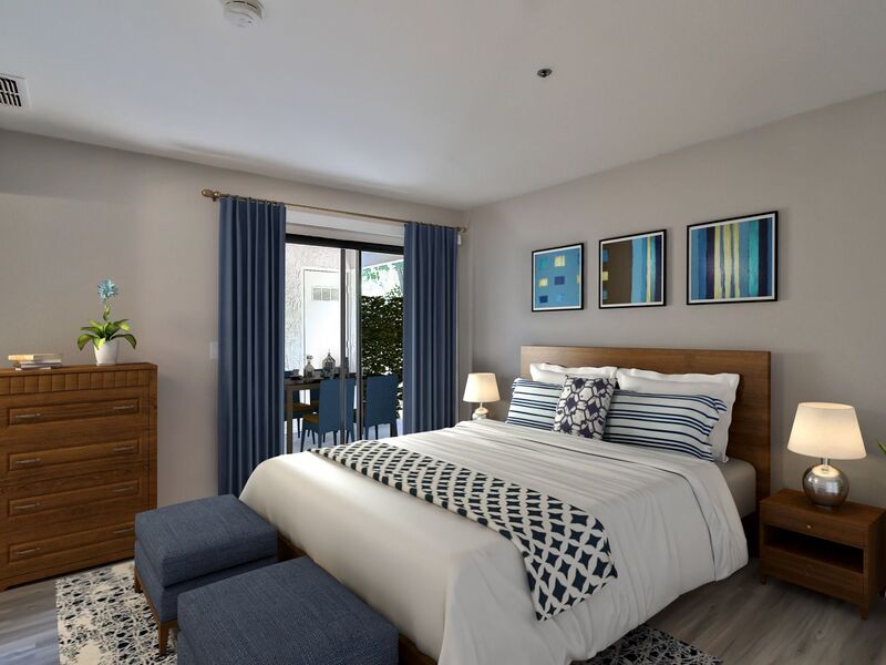 Spacious bedroom furnished with a bed and two nightstands.