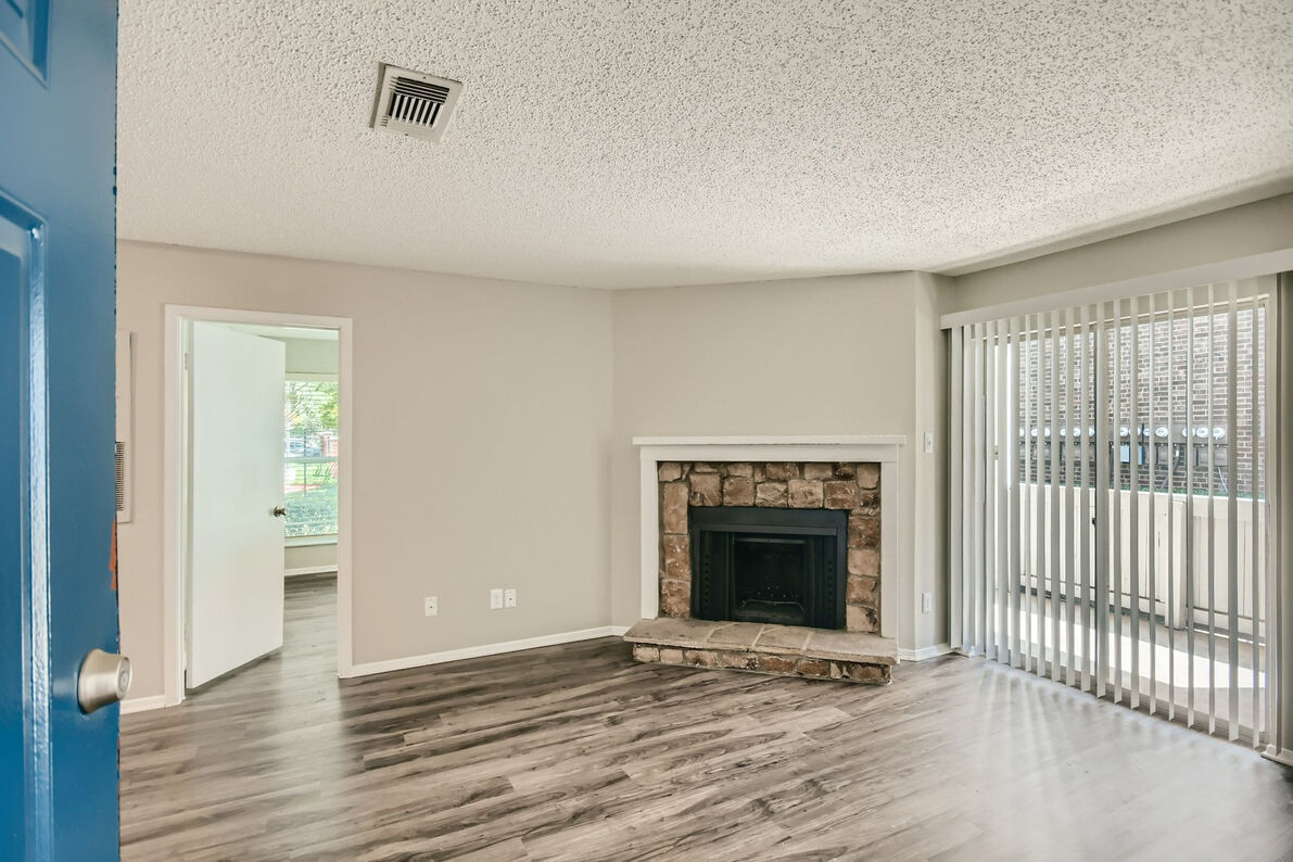 Villas at Waterchase Apartments living room fireplace - Lewisville, TX