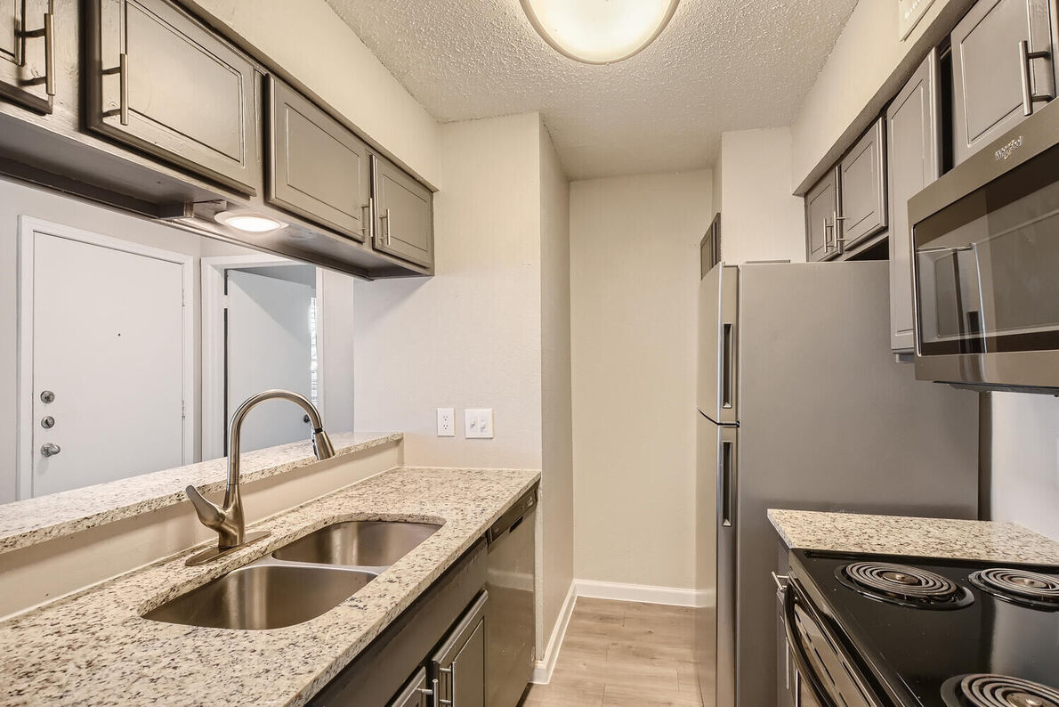 The Leighton Apartments renovated kitchen - Plano, TX