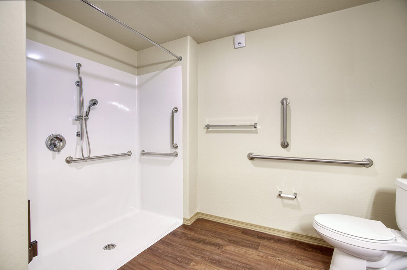 Shower and grab bars in the home shown at Harmony at the Park I & II.