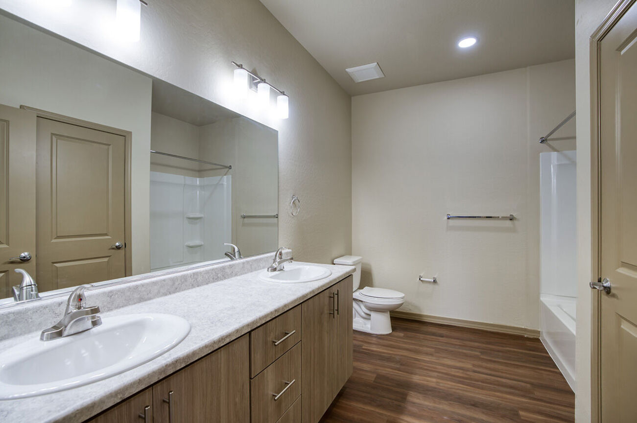 Bathroom with grab bars in the home shown at Harmony at the Park I & II.