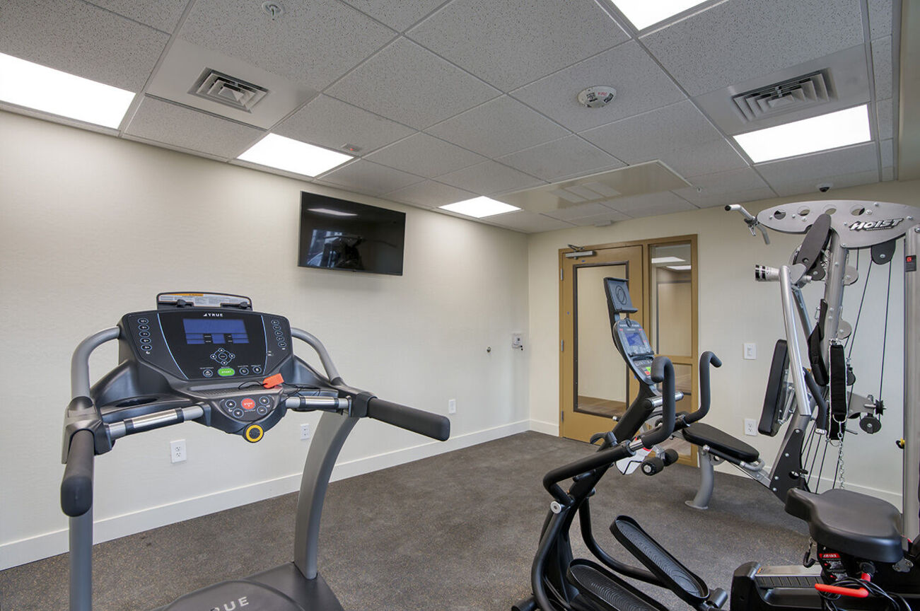 Fitness room at Harmony at the Park I & II.