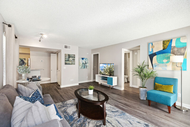 Model apartment image of main bedroom with wood style plank flooring and bedroom furniture