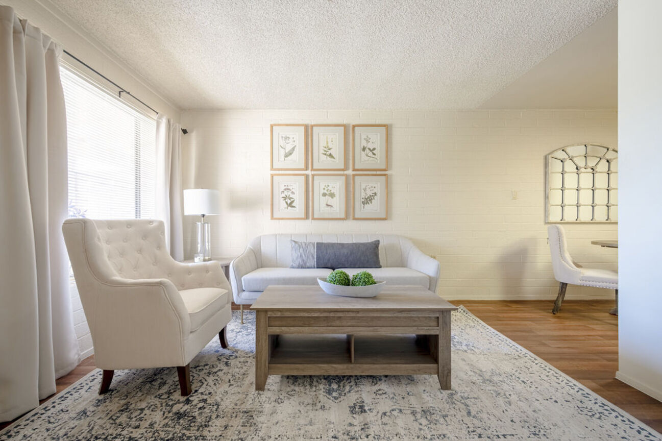 Furnished apartment living area shown at Phoenix Manor.