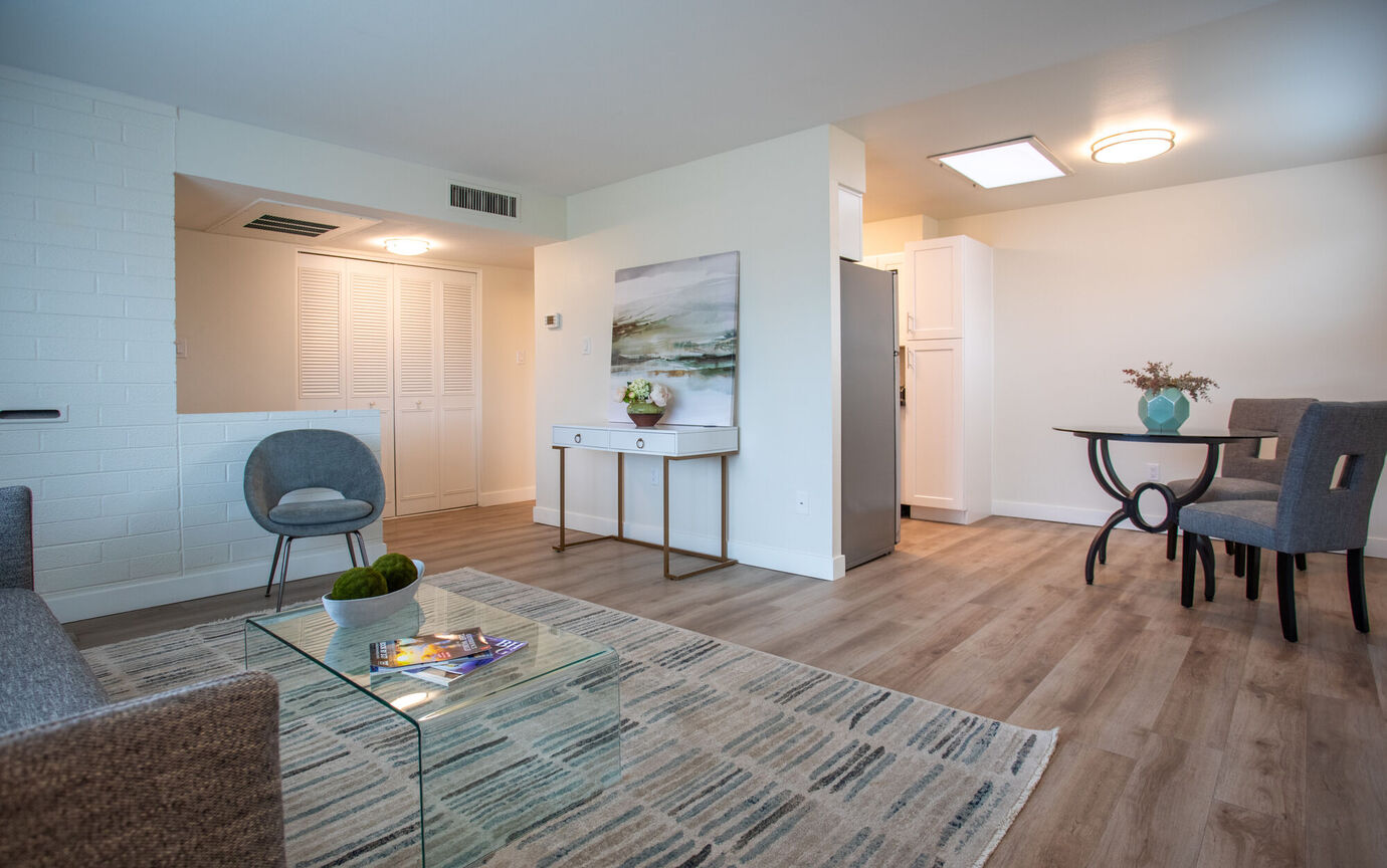 Furnished apartment living area shown at Phoenix Manor.