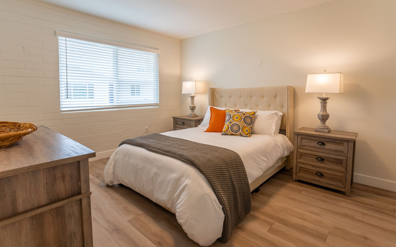 Furnished bedroom shown at Phoenix Manor.