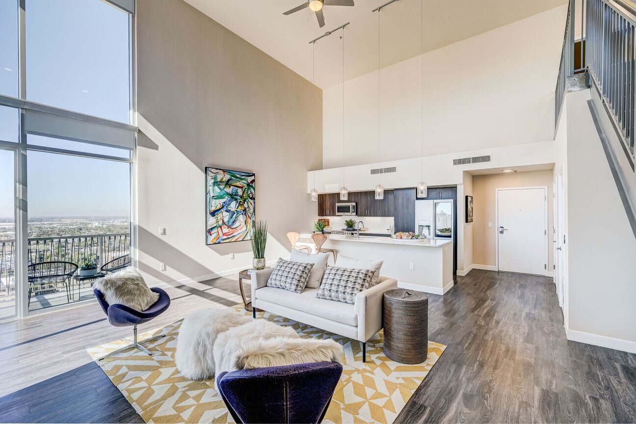 Furnished apartment living area shown at The Stewart.