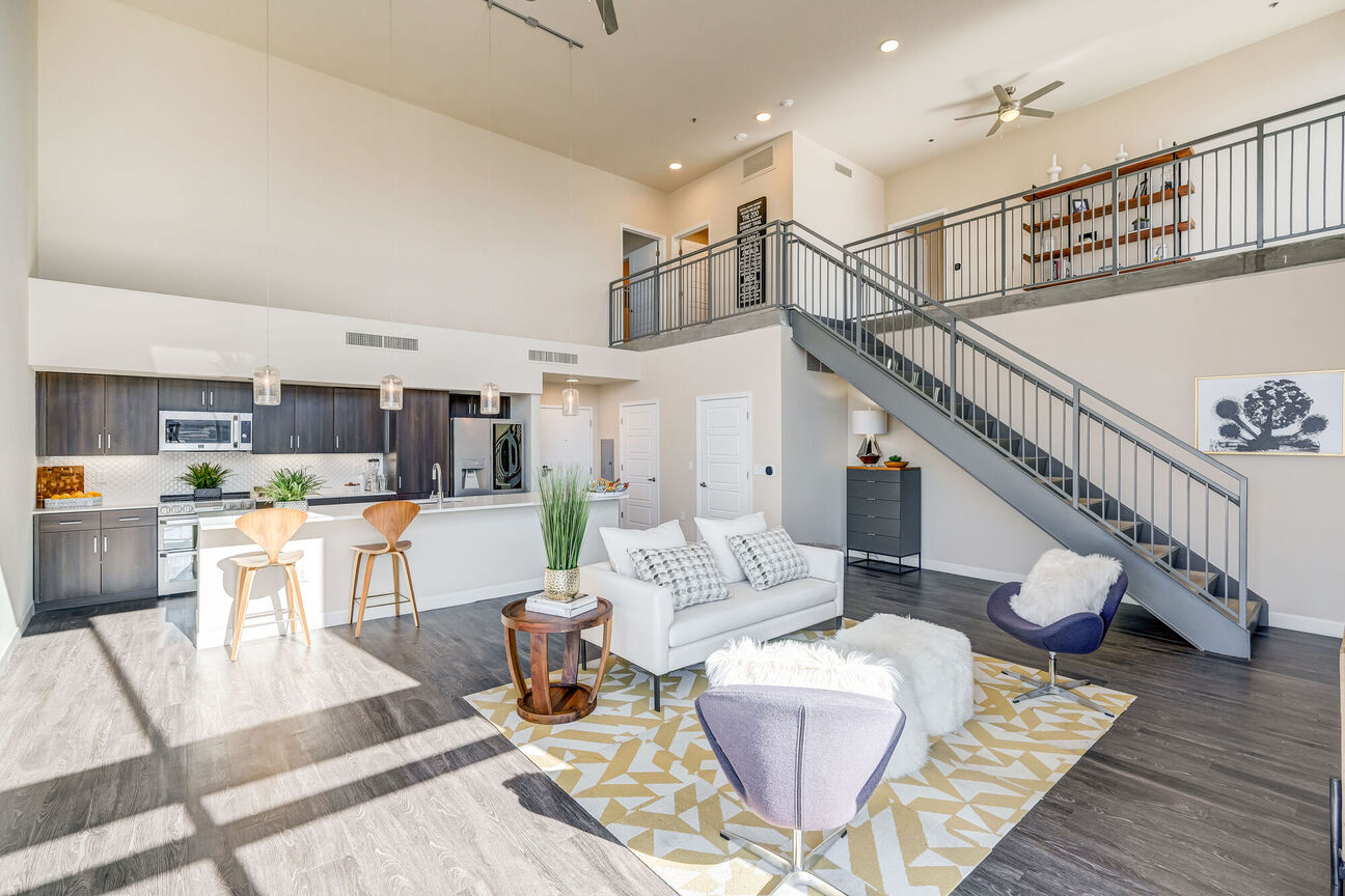 Furnished apartment living area shown at The Stewart.