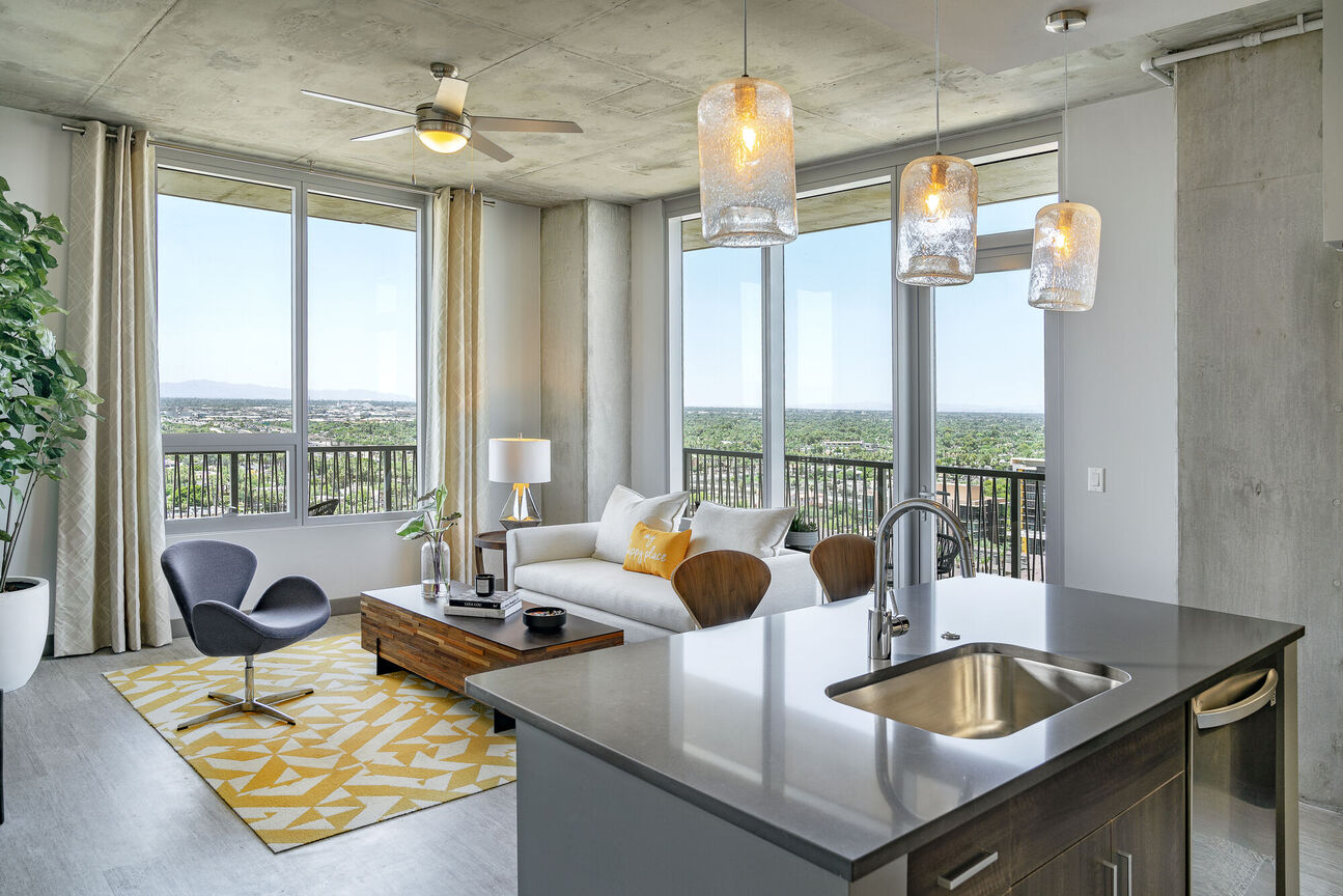 Furnished apartment living area shown at The Stewart.