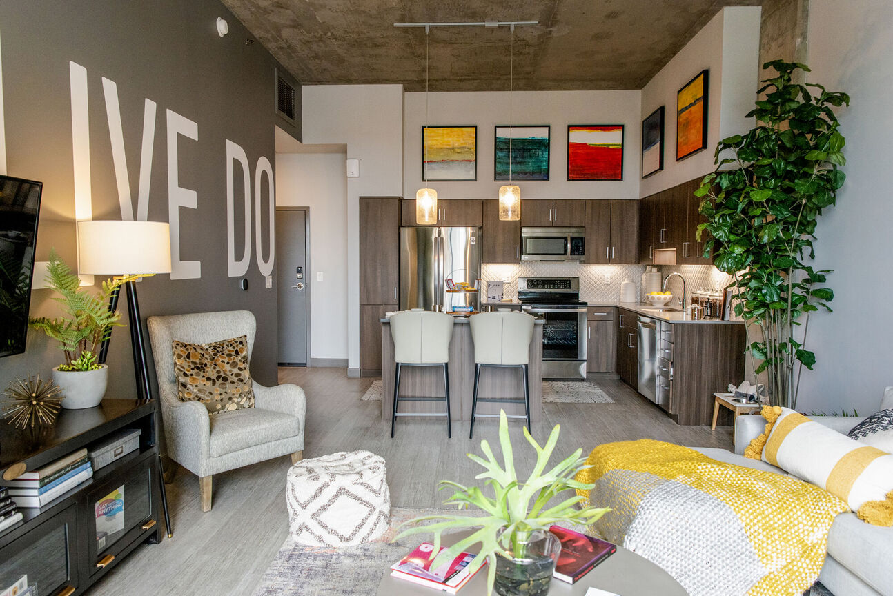 Furnished apartment living area shown at The Stewart.