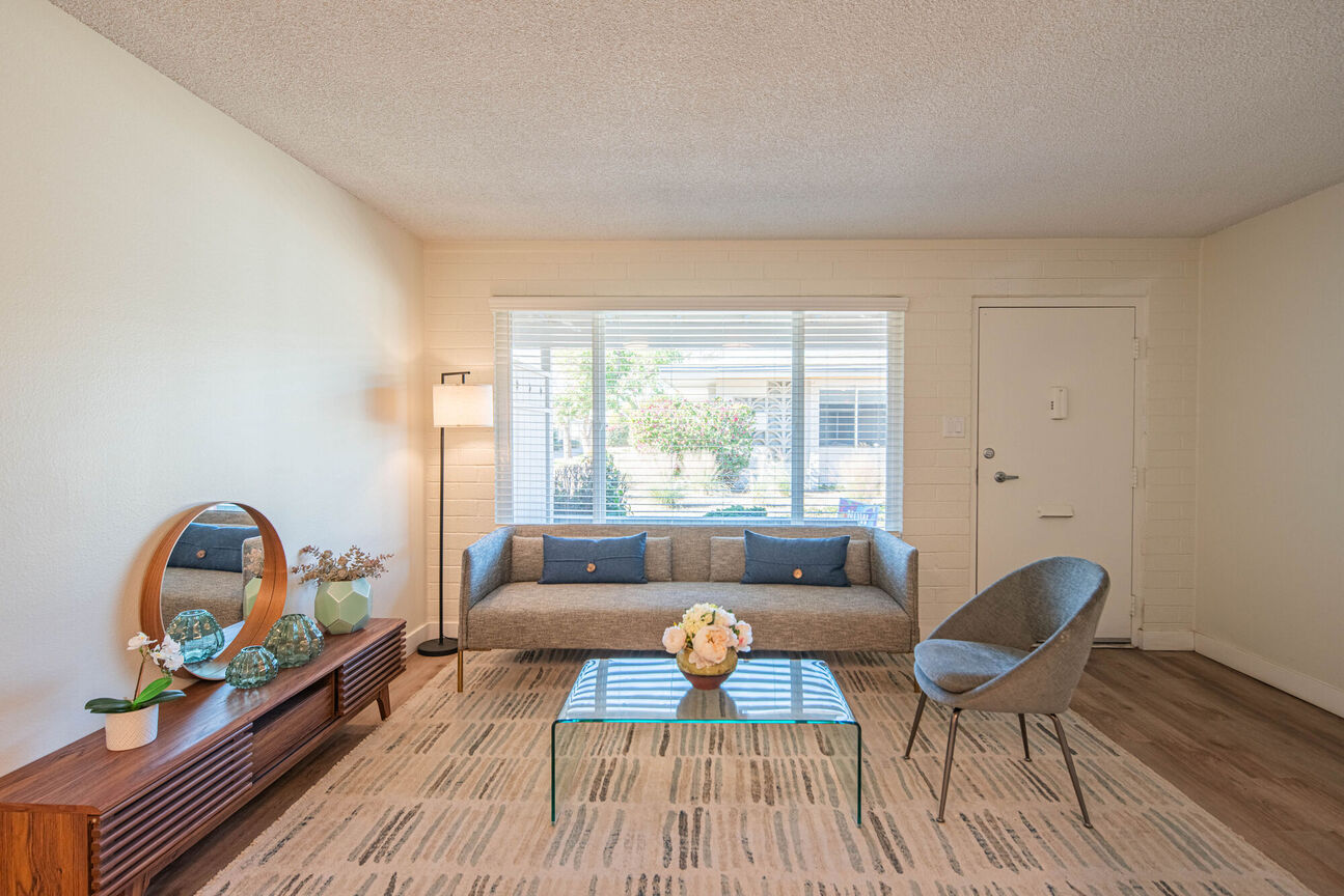 Furnished apartment living area shown at Phoenix Manor.