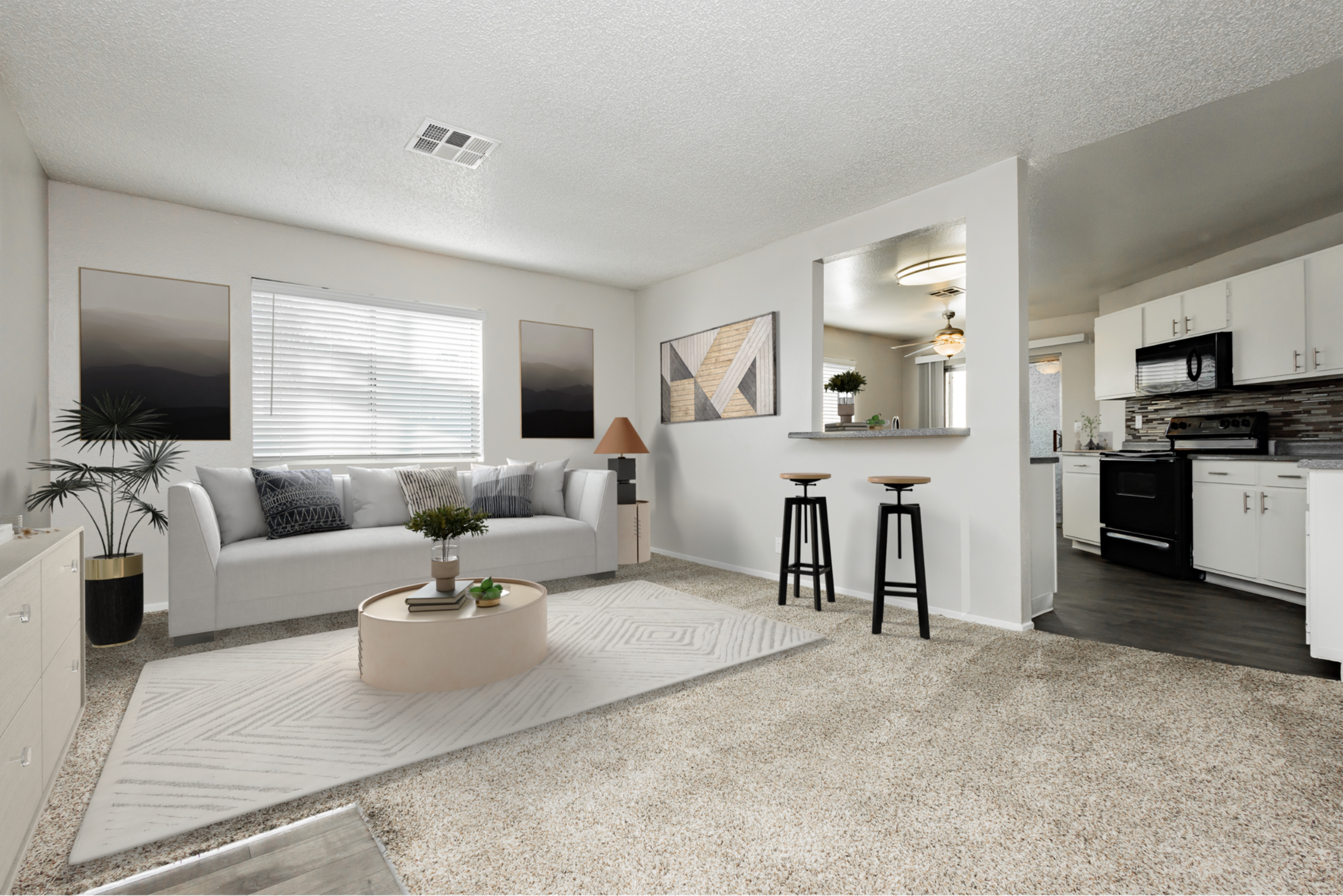 Modern living room with couch, plant, and floor lamp.