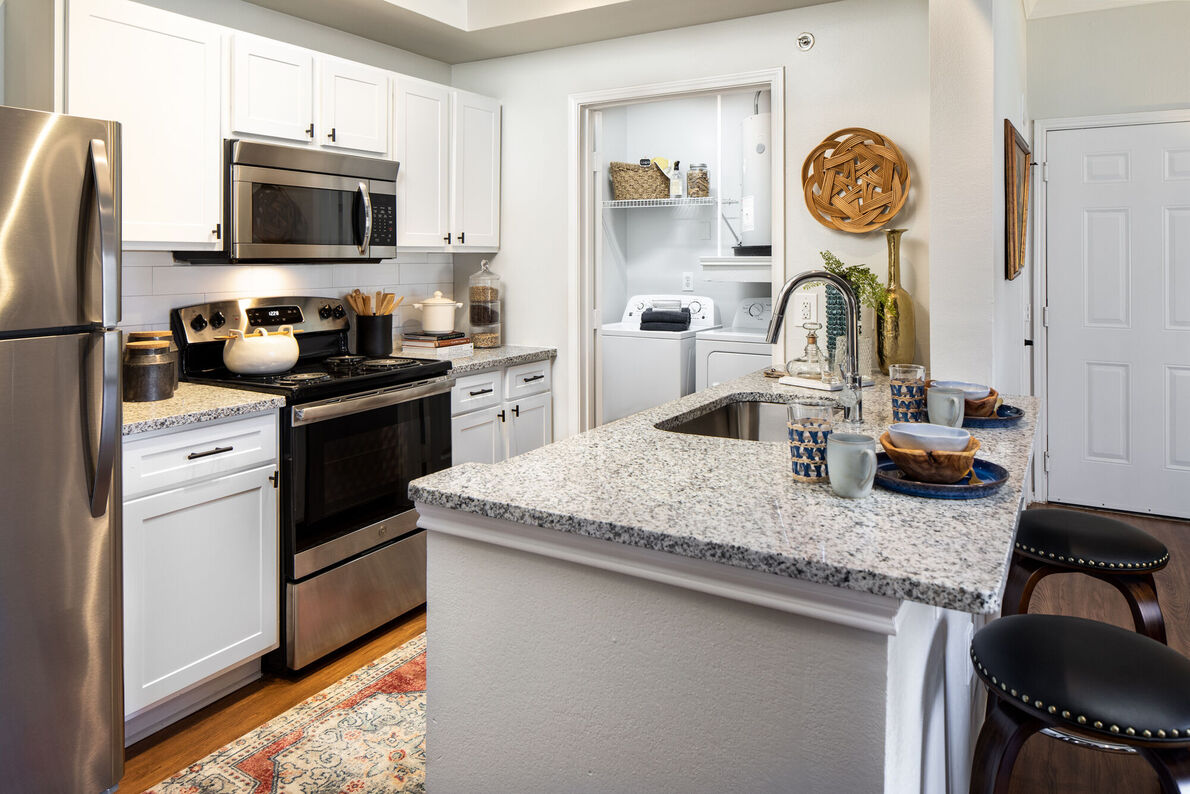 Dixon at Stonegate apartment kitchen with island - Fort Worth, TX