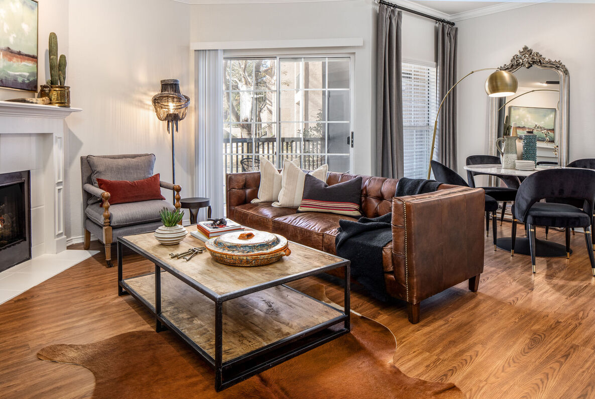 Dixon at Stonegate apartment living room with balcony doors - Fort Worth, TX