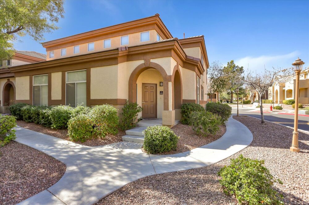 Exterior of building with entrance to apartment home.