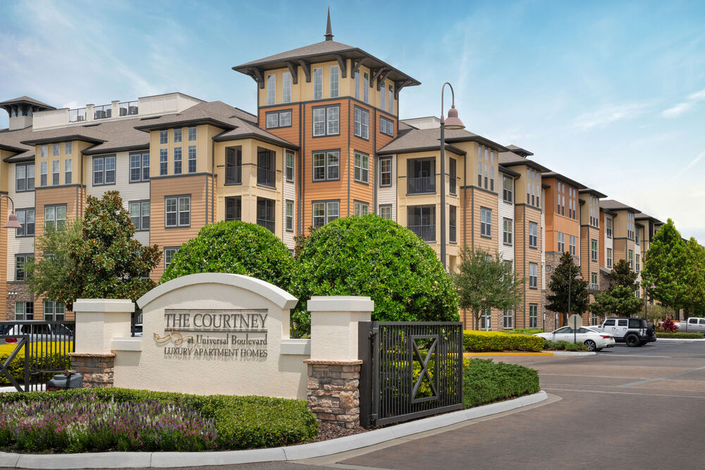 The Courtney at Universal Boulevard - Image of the front of the leasing center, management office.